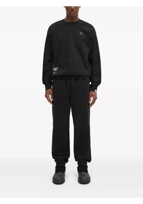 This Is Never That elasticated-ankle track pants - Black
