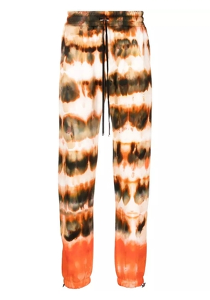 AMIRI tie-dye print cotton track pants - Brown