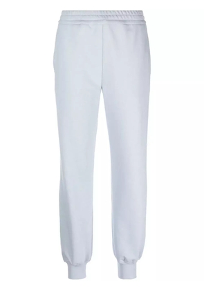 Alexander McQueen logo-print track pants - Blue