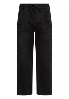 AMIRI distressed finish straight-legged jogging trousers - Black