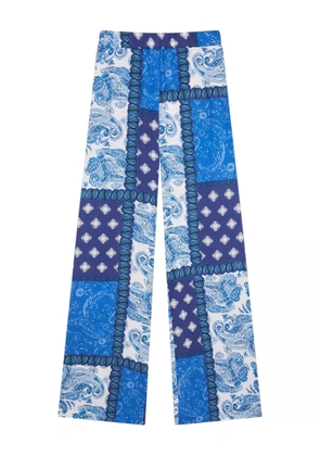Donde Esteban patchwork-print trousers - Blue
