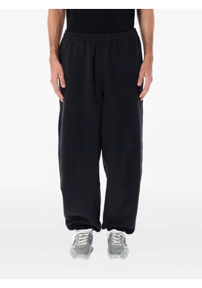 Nike swoosh-embellished track pants - Black