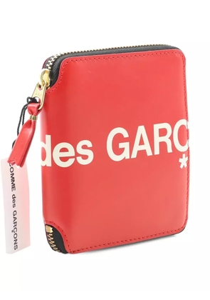 Comme Des Garçons logo-print round zipper wallet - Red