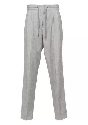 Brunello Cucinelli herringbone-pattern tapered trousers - Grey