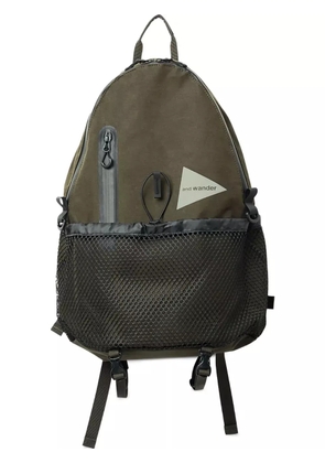 and Wander triangular-logo backpack - Green