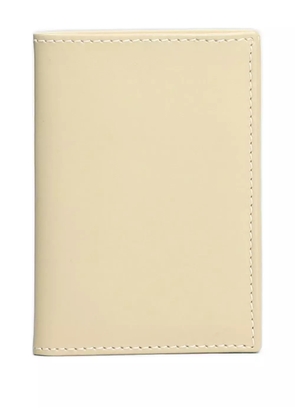Comme Des Garçons Wallet textured bi-fold wallet - Neutrals