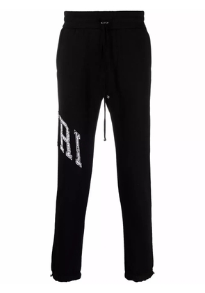 AMIRI logo-print track pants - Black