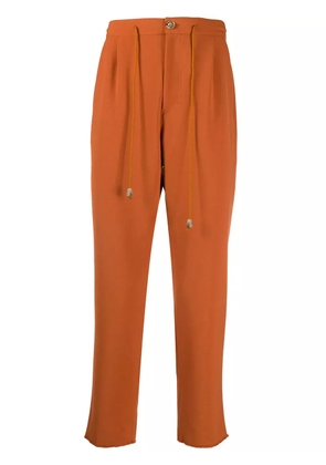 Nanushka cropped track trousers - Orange