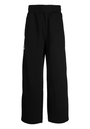 izzue logo-appliqué wide-leg trousers - Black