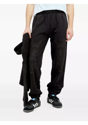 Nancy Ganz graphic-print fleece trousers - Black