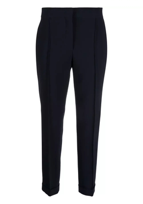 Moschino pressed-crease concealed-fastening tapered trousers - Blue