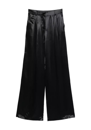 THE ANDAMANE pleat-detail trousers - Black