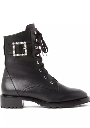 Stuart Weitzman pearl-embellished buckled combat boots - Black