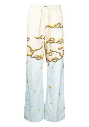 AMIRI Sunscape-print flared trousers - Yellow