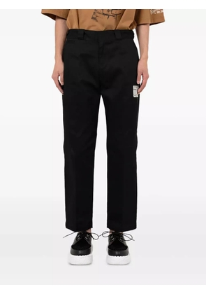 Maison MIHARA YASUHIRO label-detail trousers - Black