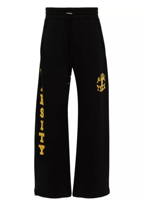 AMIRI flocked-logo cotton track pants - Black