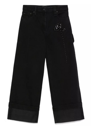Simone Rocha Carnation-embellished jeans - Black