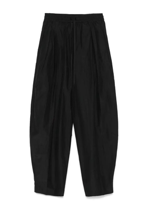 THE ANDAMANE pleat-detail trousers - Black