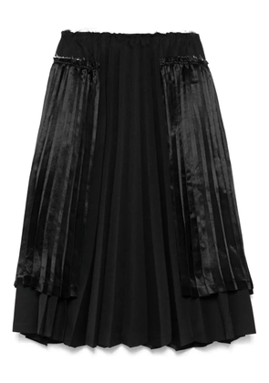 Black Comme Des Garçons pleated midi skirt