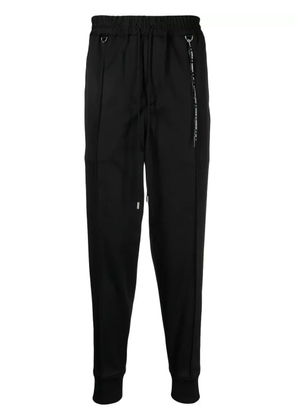 Mastermind World logo-print drawstring track pants - Black