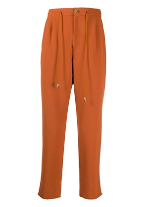 Nanushka cropped track trousers - Orange