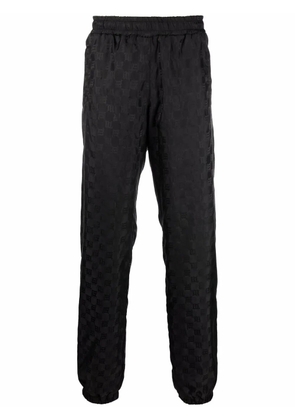 MISBHV logo-monogram tapered joggers - Black