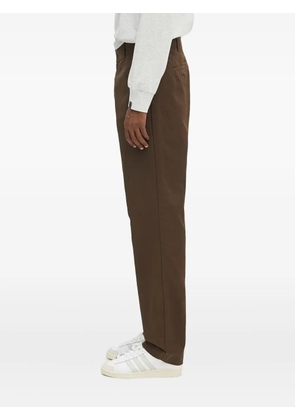 Carhartt WIP flat-front logo-patch trousers - Brown