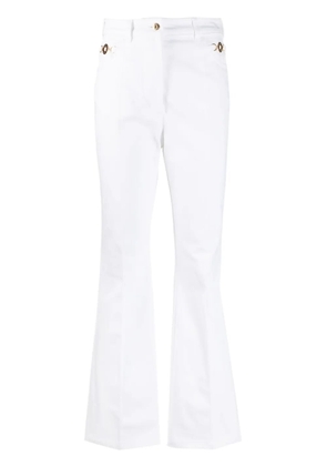 Patou logo-embroidered flared jeans - White