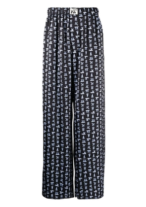 Natasha Zinko Yoga Bunny-print wide-leg trousers - Black