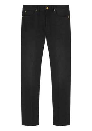 Versace logo-embroidered slim cut jeans - Black