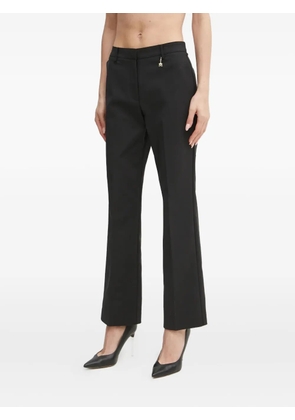 Marciano logo-charm trousers - Black