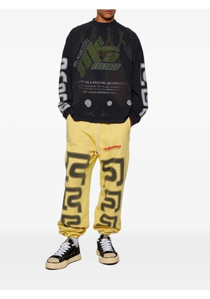 RRR123 drawstring graphic-print trousers - Yellow