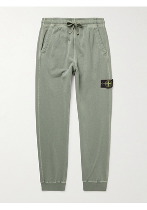Stone Island - Tapered Logo-Appliquéd Garment-Dyed Cotton-Jersey Sweatpants - Men - Green - S