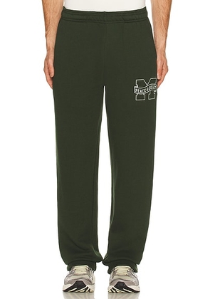 Museum of Peace and Quiet Banner Sweatpants in Forest - Green. Size L (also in M, S, XL/1X, XS).