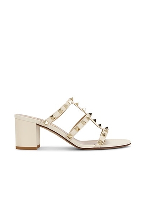 Valentino Garavani Rockstud Slide Mule in Light Ivory - Ivory. Size 36.5 (also in 36, 38.5, 39, 39.5, 40, 41).
