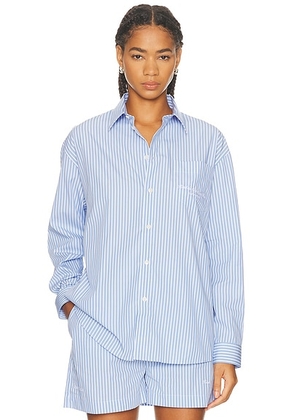 Sporty & Rich x Hotel Du Cap Eden Roc Eden Script Oversized Shirt in Blue & White Stripe - Blue. Size M (also in L, S, XL, XS).