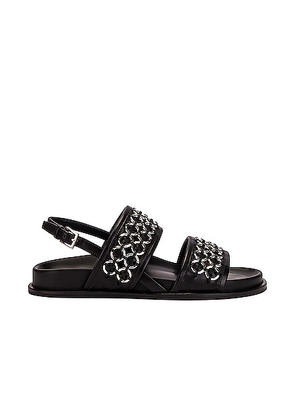 ALAÃA Eyelet Slingback Sandals in Noir - Black. Size 35 (also in ).