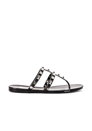 Valentino Garavani Summer Rockstud PVC Thong Sandal in Nero - Black. Size 38 (also in 41).