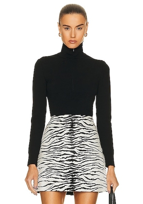 ALAÃA Minimalist Turtleneck in Noir - Black. Size 34 (also in ).