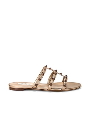 Valentino Garavani Rockstud Slide in Skin - Metallic Gold. Size 36 (also in 36.5, 39.5, 40, 41).