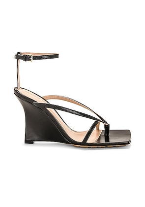 Bottega Veneta Stretch Ankle Strap Wedge Sandal in Black - Black. Size 36.5 (also in 35, 35.5, 38.5, 41).