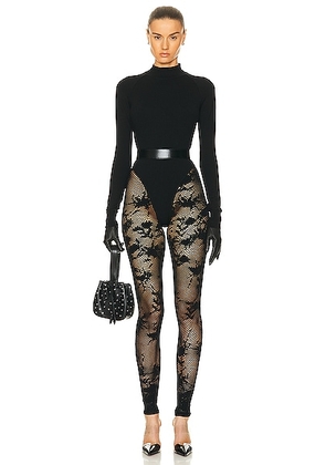 ALAÏA Turtleneck Catsuit in Noir - Black. Size 36 (also in ).