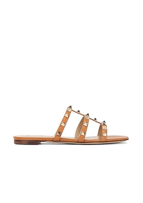 Valentino Garavani Rockstud Slide in Almond Beige - Tan. Size 36.5 (also in 36, 39, 39.5).