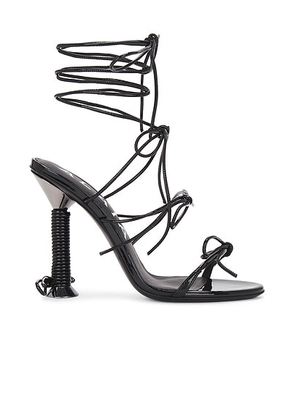 ALAÃA Strappy Sandal in Noir & Argent - Black. Size 36 (also in 38).