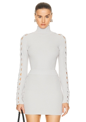 ALAÏA Long Sleeve Turtleneck Top in Gris Perle - Light Grey. Size 42 (also in 34).