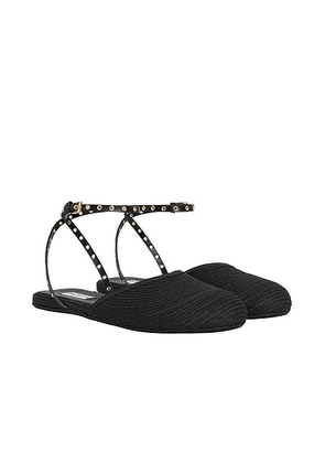 ALAÏA Flat Sandal in Noir - Black. Size 36.5 (also in 36, 37, 37.5, 38, 38.5, 39, 39.5, 40).