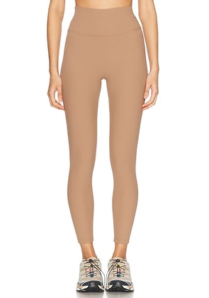 Beyond Yoga Impulse Midi Legging in Desert Sand - Brown. Size S (also in L, XS).