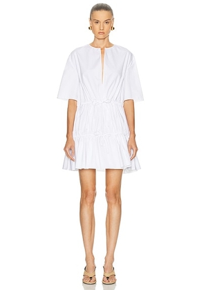 ALAÏA Short Sleeve Ruffle Dress in Blanc - White. Size 34 (also in 36, 38, 40, 42).