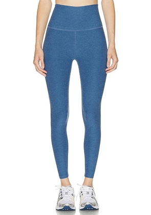 Beyond Yoga Spacedye Caught In The Midi High Waisted Legging in Washed Denim - Blue. Size L (also in S, XS).