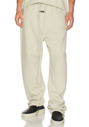 Fear of God ESSENTIALS Relaxed Fleece Sweatpant in Heather Stone - Grey. Size L (also in ).